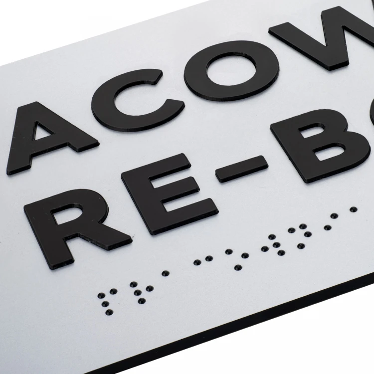 Tabliczka z wypukłymi literami i pismem Braille'a - laminat srebrny - wym. 295x100mm - TAB498